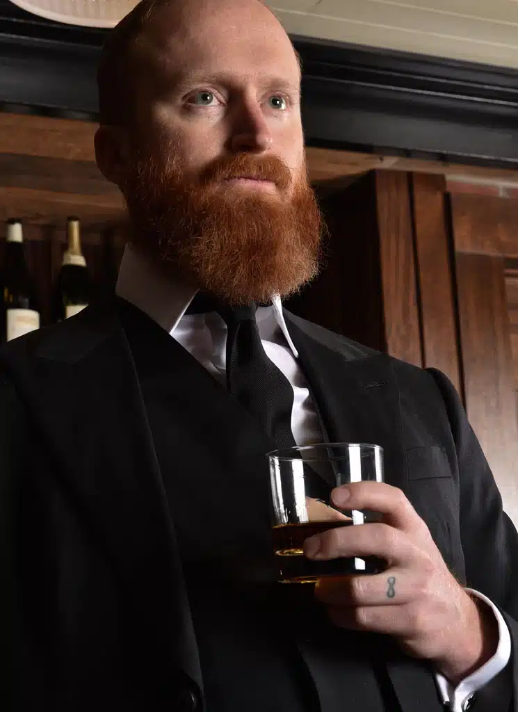 Close-up view of Michael Andrews Bespoke Black Suit
