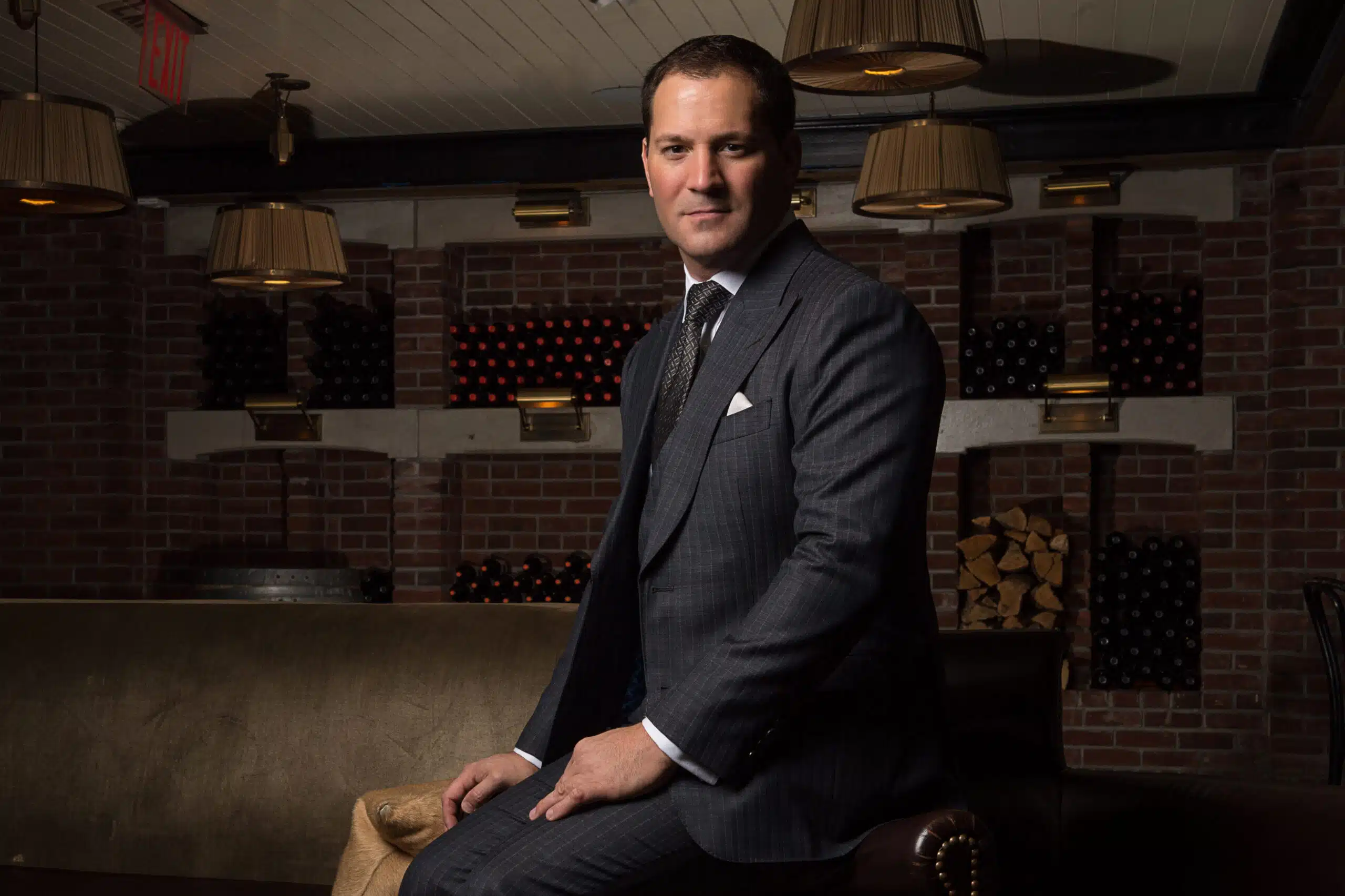 Michael Andrews in custom dark charcoal pinstripe suit