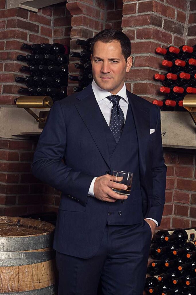 Michael Andrews in custom blue 3-piece suit