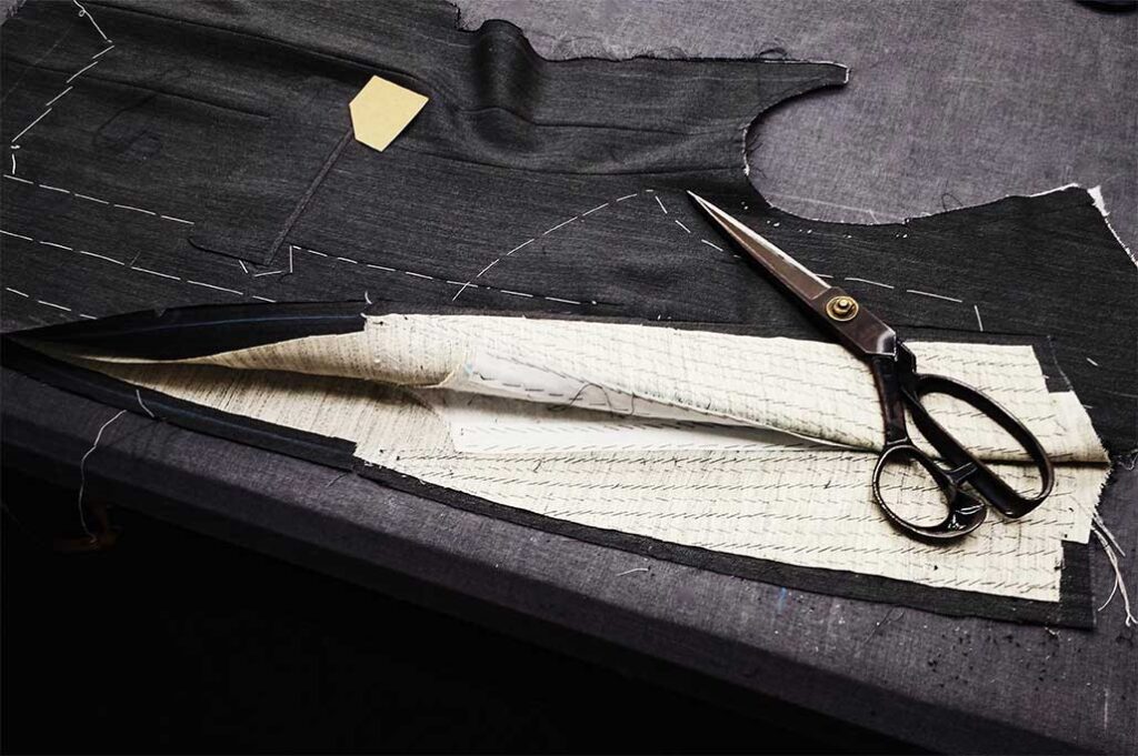 Michael Andrews Process - Tailoring scissors on a partially constructed suit piece