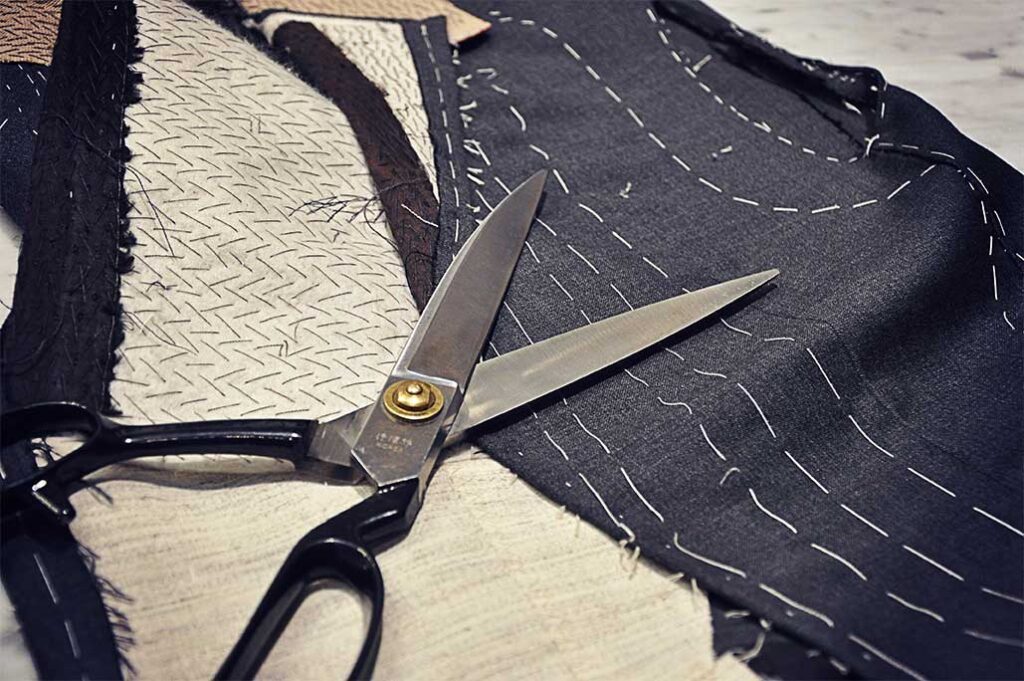 Michael Andrews Process - Tailoring scissors on hand-stitched fabric