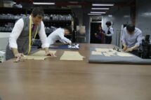 MAB Workshop with tailors working on fabric cutting and pattern making