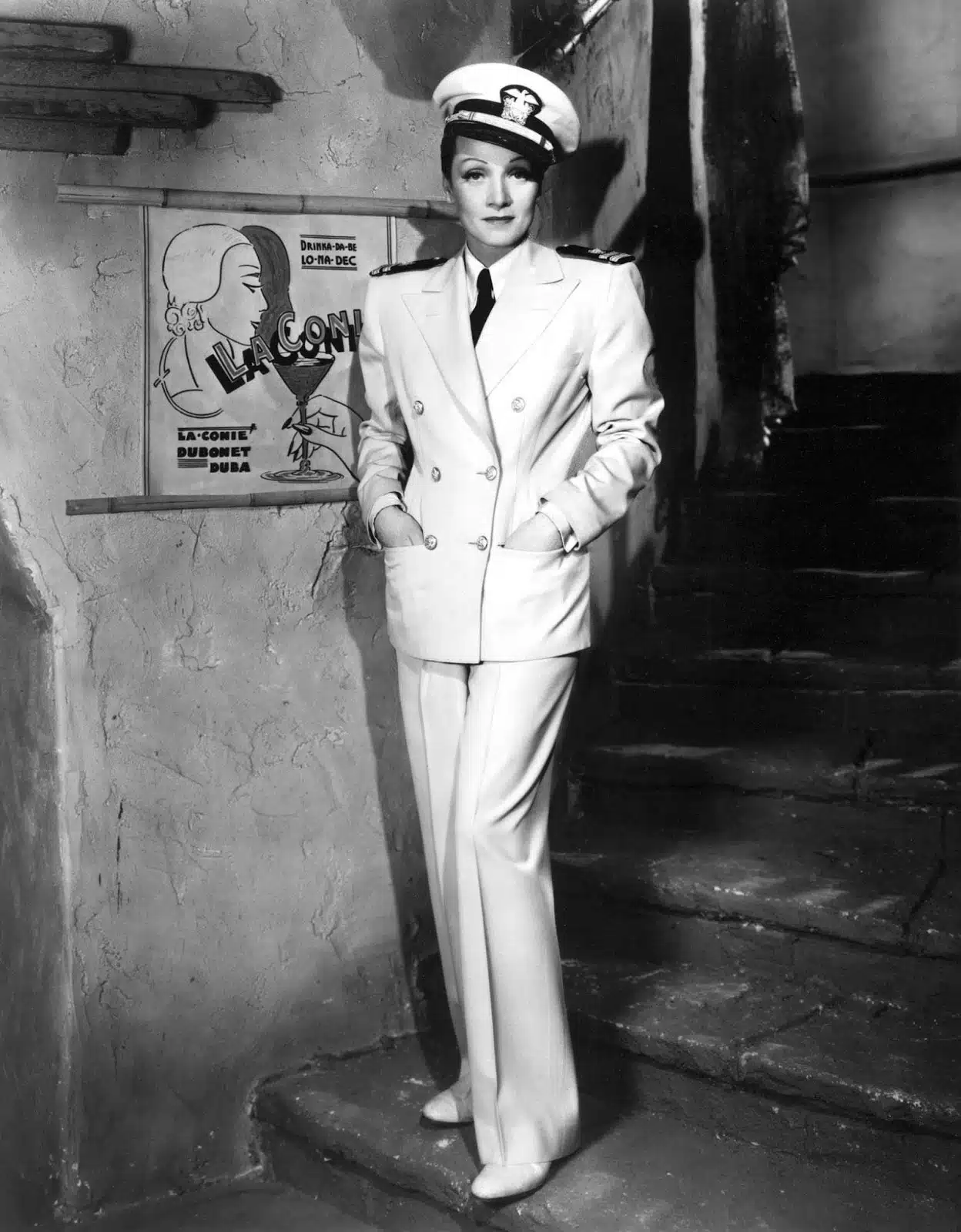 Black-and-white photo of Marlene Dietrich in a naval-style white suit
