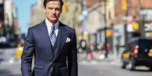 George in custom pinstripe suit, menswear banner