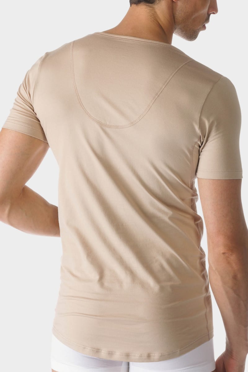 Back view of the model in beige undershirt