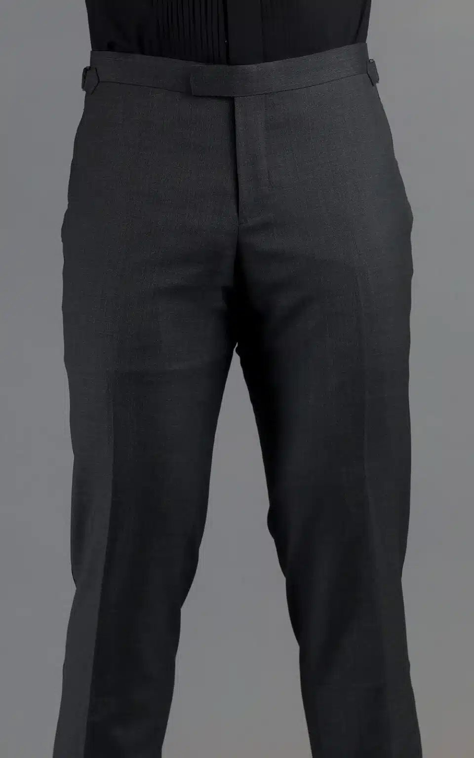 Back view of grey wool MTM tuxedo trousers showcasing the tailored fit