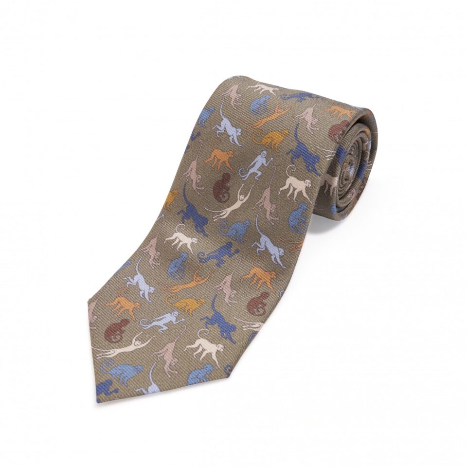(product) Green with Blue, White & Tan Monkeys Silk Necktie, Rolled