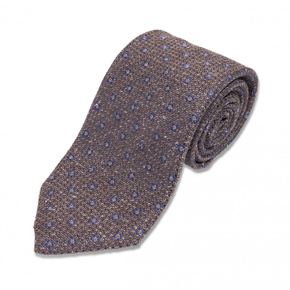 (product) Brown with Blue Medallion Silk Necktie, Rolled view