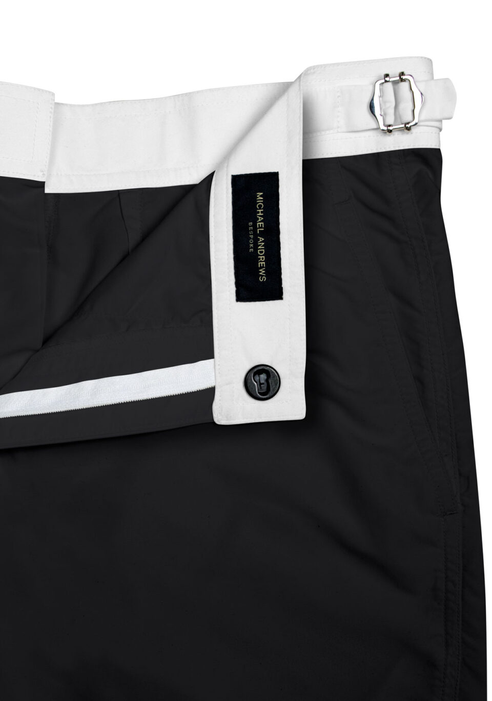 (product) Black Swim Shorts with White Waistband, close-up view