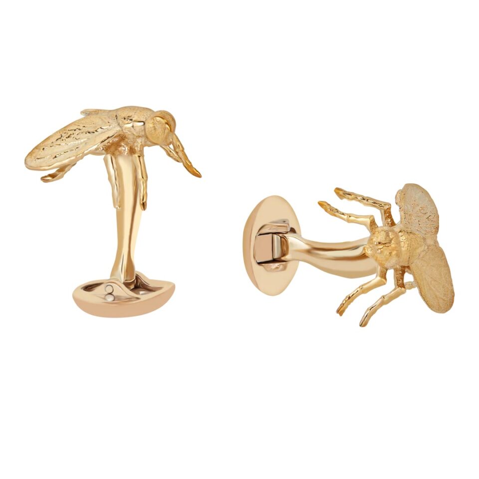 (product) The Goldblum Cufflinks, gold-tone insect design featuring intricate wing and body details