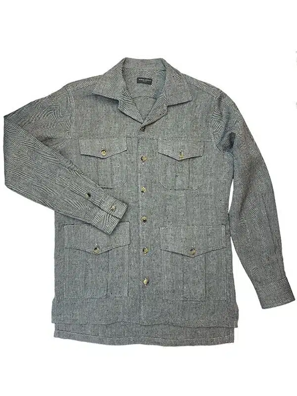 (product) Black & White Herringbone Linen Safari Shirt Jacket with buttoned chest and waist pockets, laid flat to display its texture and design