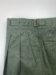 Close-up of waistband with pleats and buckle details of Green Cotton Gurkha Trousers