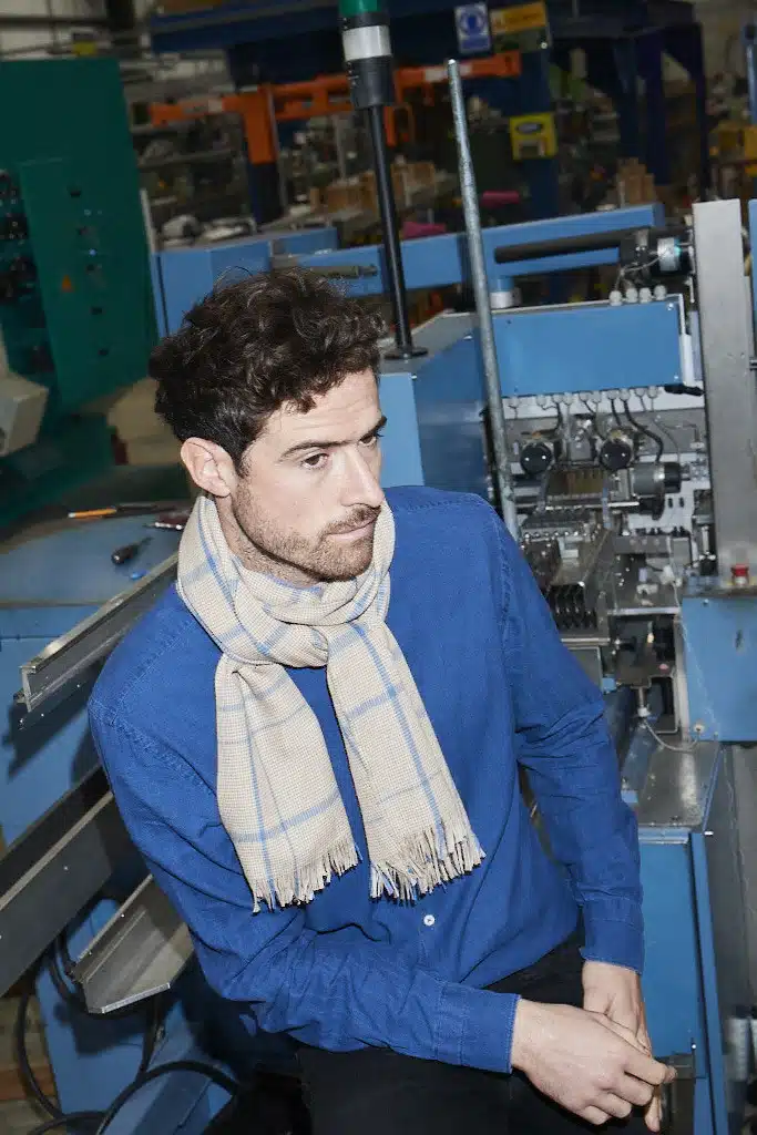 (product) Camel Lightweight Merino Semi-Plain Scarf worn by a model
