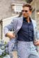 (product) Irregular Stripe Seersucker Suit, worn with a relaxed pose outdoors