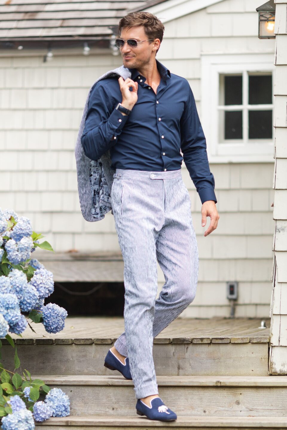 (product) Irregular Stripe Seersucker Suit, worn casually with the jacket draped over the shoulder