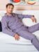 (product) Red & Dark Blue Stripe Pajama Shirt, worn by a model lounging in a relaxed setting