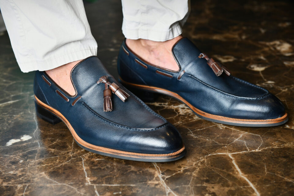 (product) Napoli Navy Loafer, close-up view worn by a model