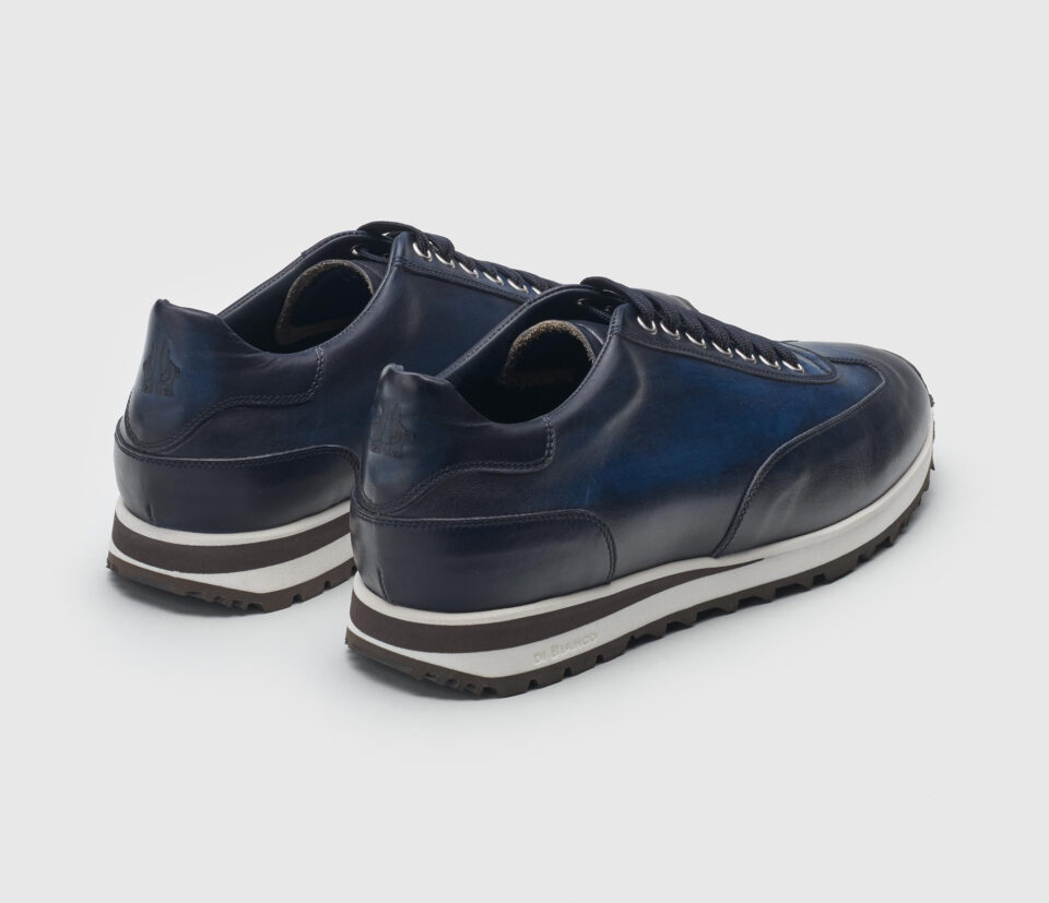 (product) Trieste Navy Dress Sneaker, Angled pair view