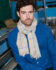 (product) Camel Lightweight Merino Semi-Plain Scarf worn by a model
