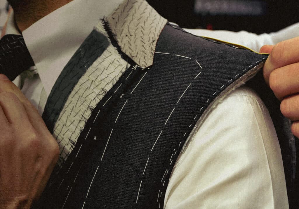 Hero Image Basted Fitting Measuring Shoulder bespoke tailor nyc, soho, noho, financial district, chelsea, midtown - custom suits nyc bespoke tailor midtown, noho
