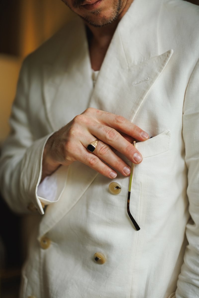 Detailed view of Cory's cream suit
