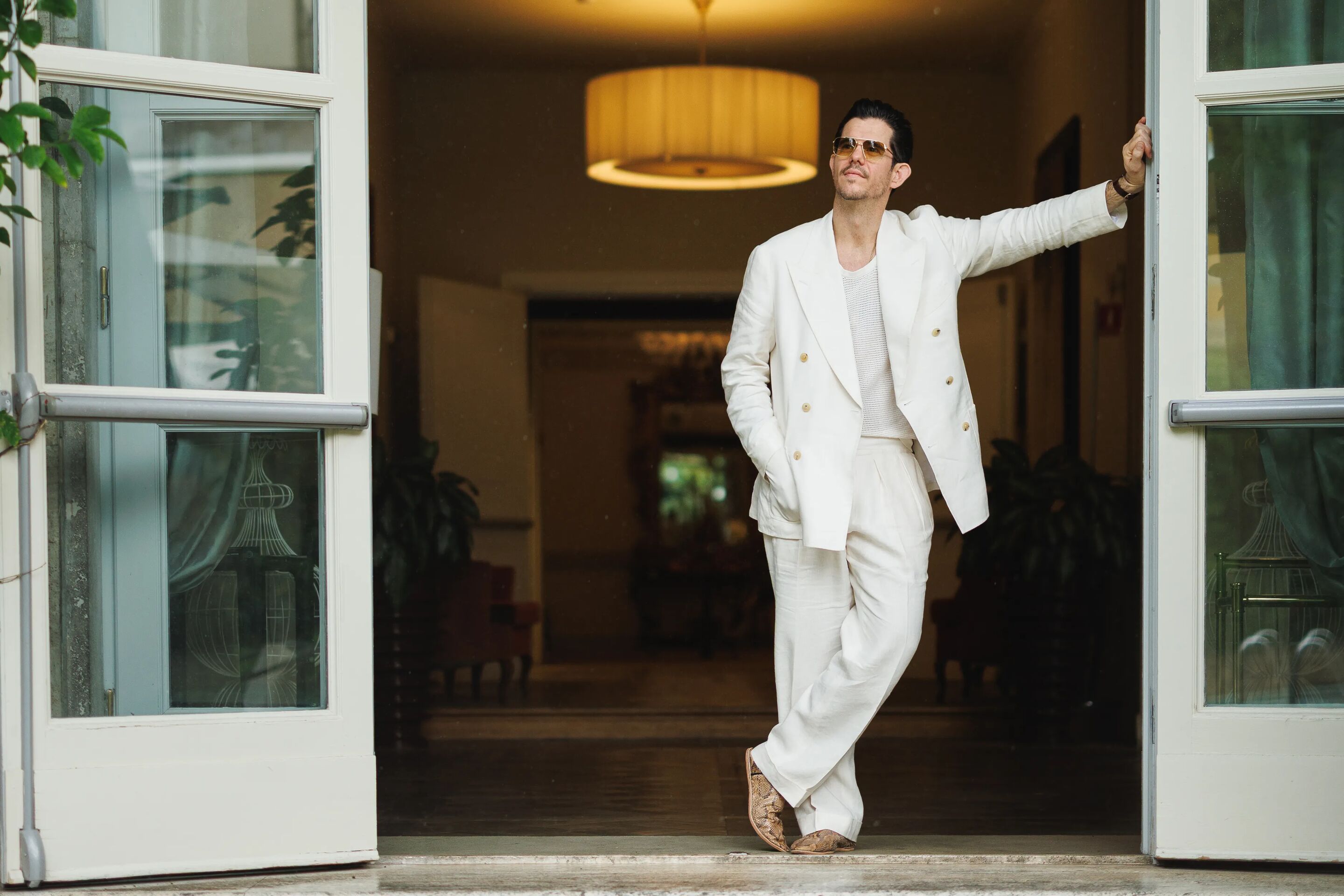 Cory in an off white linen suit