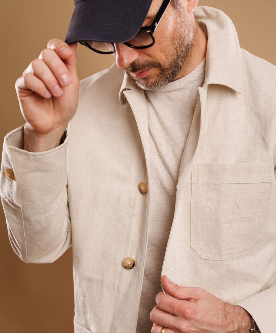 Close-up of man in a natural cotton-linen canvas chore coat