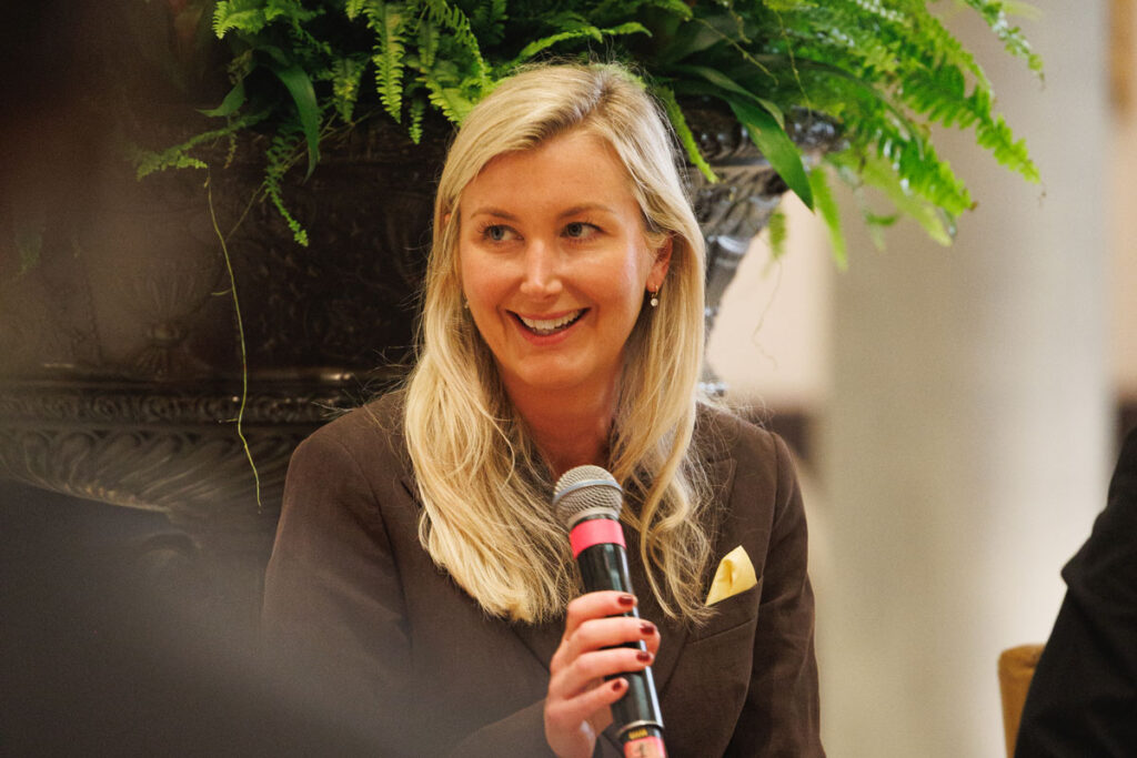 3512eb7f-34fd-0d18-ef19-ee34431c24d7 Caroline Andrew speaking into a microphone at the panel