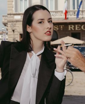 Giulia Guidi at The St. Regis Florence wearing a contemporary Le Smoking-inspired tuxedo in Dormeuil Super Brio for MAB’s 20 for 20 lookbook.