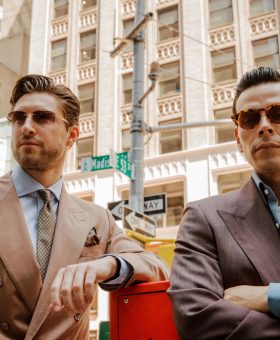Steve Gonzalez and Julian Piket on Madison Avenue in New York wearing tailored suits for Michael Andrews Bespoke’s 20 for 20 lookbook.