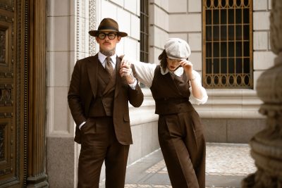 Damien and Corinne Broderick wearing coordinated brown tailored looks in Dormeuil 4 Elements for MAB’s 20 for 20 anniversary lookbook.