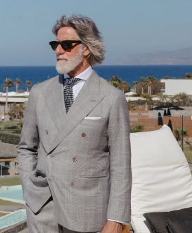 Franco Mazzetti wearing a black-and-white glen check suit with a subtle lavender overcheck in Dormeuil 15.7 for MAB’s 20 for 20 lookbook.