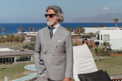 Franco Mazzetti wearing a black-and-white glen check suit with a subtle lavender overcheck in Dormeuil 15.7 for MAB’s 20 for 20 lookbook.
