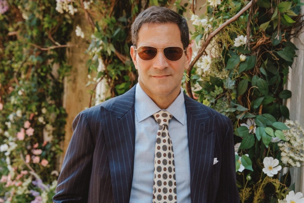 Michael Andrews wearing a navy pinstripe suit in Dormeuil Amadeus for Look No. 20 of Michael Andrews Bespoke’s 20 for 20 anniversary lookbook.