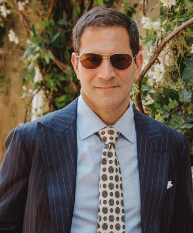 Michael Andrews wearing a navy pinstripe suit in Dormeuil Amadeus for Look No. 20 of Michael Andrews Bespoke’s 20 for 20 anniversary lookbook.
